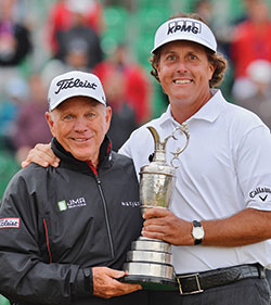 Phil Mickelson and his coach Butch Harmon pose with the Claret Jug after winning the 142nd Open Championship at Muirfield