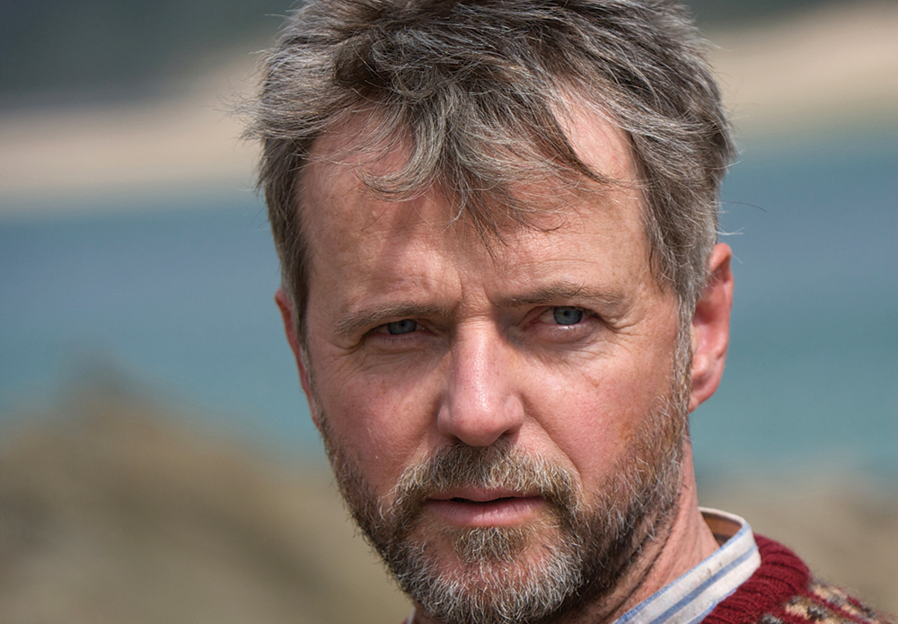 A bearded Aidan Quinn on the set of A Shine of Rainbows