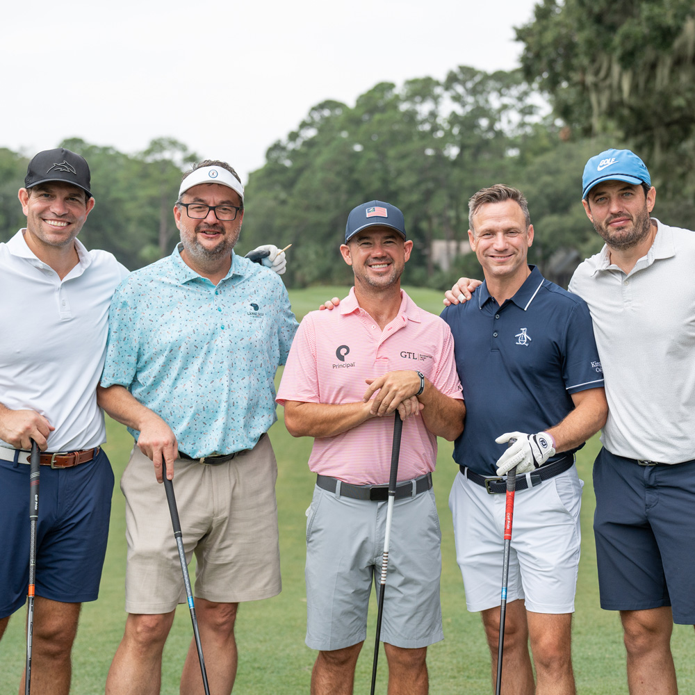 Guests pose with PGA TOUR player, Brian Harman